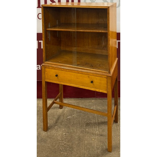 84 - An Art Deco Heals style oak bookcase on stand