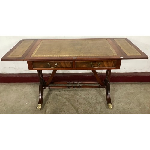 103 - A Regency style mahogany and green leather topped drop-leaf sofa table