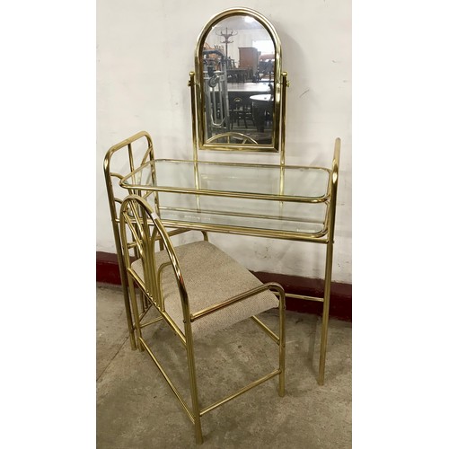 104A - An Art Deco style gilt metal lady's dressing table and stool