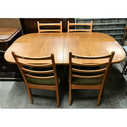 55D - A teak rectangular extending dining table and four chairs