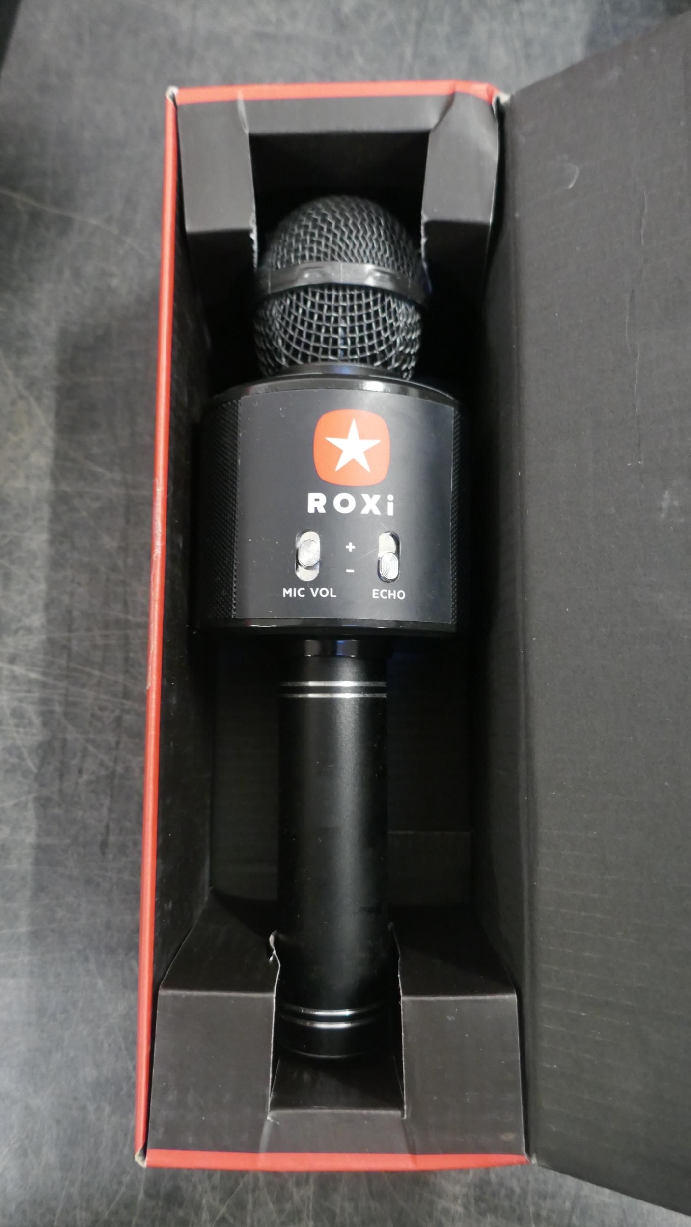A PlayStation 3 console with Guitar Hero and a Roxi microphone, mobile ...