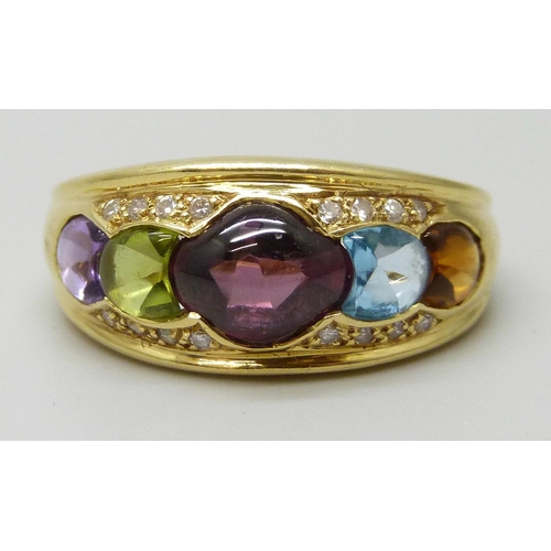 7031 - An 18ct gold multi gemstone set ring, 5.7g, P