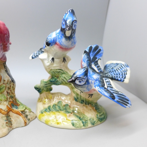 2083 - Four Beswick pottery model birds, 925 Blue Jays, 927 Red Cardinal, 929 Chickadee and 930 Parakeet