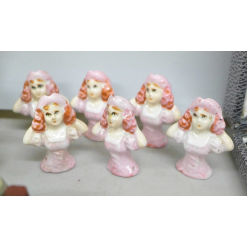 2143 - Two china brooches with a matching pair of earrings, two shoe pin cushions, a china posy, four large... 