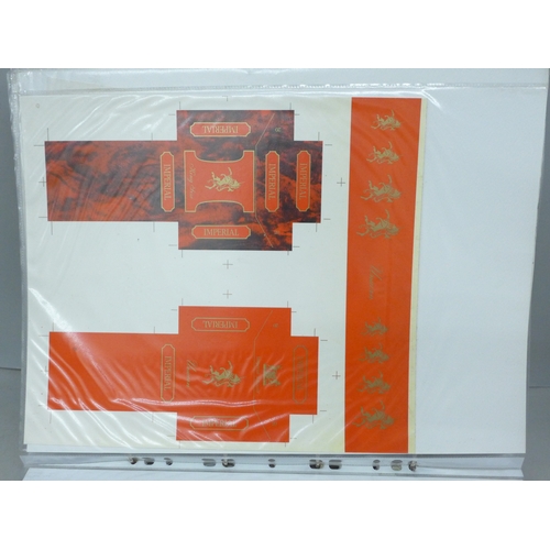 2144 - A very large album of cigarette adverts and prototype flat pack artwork, John Player's, Will's, Impe... 