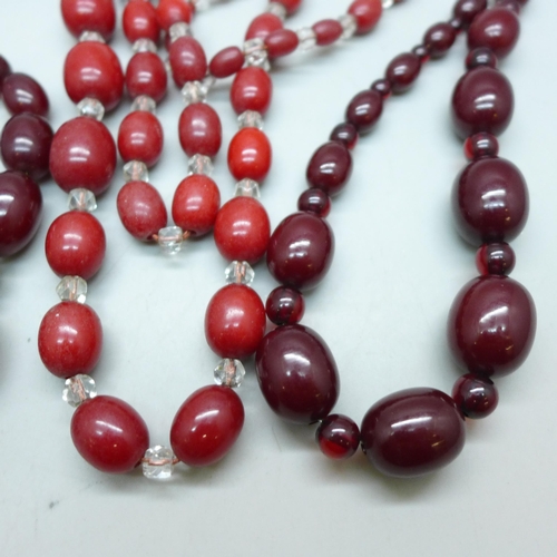 7296 - Two Bakelite bead necklaces, 80g combined (spacers on one not Bakelite), and two other red bead neck... 
