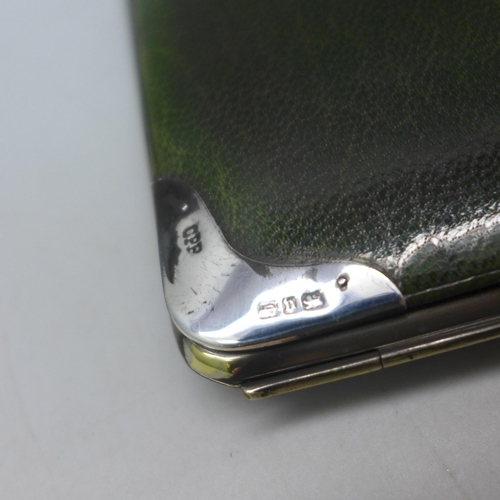 7384 - A Victorian silver mounted leather wallet, Birmingham, 1895, 9.5 x 9.2cm, initials to interior