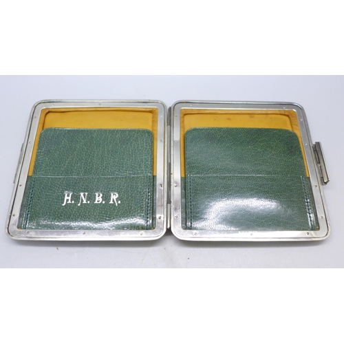 7384 - A Victorian silver mounted leather wallet, Birmingham, 1895, 9.5 x 9.2cm, initials to interior