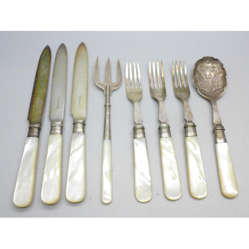 7396 - A collection of silver plated knives and forks with mother of pearl handles, a silver fork example, ... 
