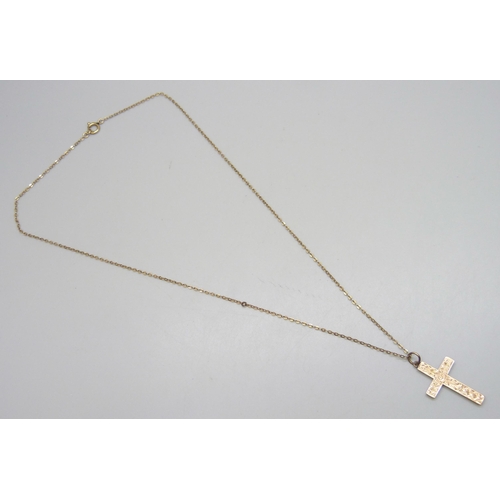7119 - A 9ct gold cross pendant, on a 9ct gold chain, 1.9g total, pendant 3.2cm including bail