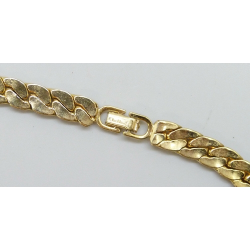 7195 - A vintage Christian Dior gold tone green and white stone necklace, 39cm