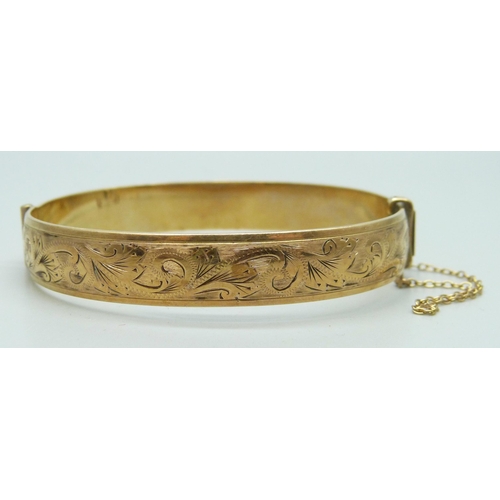 7274 - A 1/5 9ct rolled gold bangle, 23g