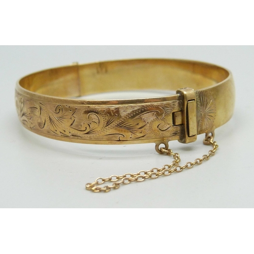 7274 - A 1/5 9ct rolled gold bangle, 23g