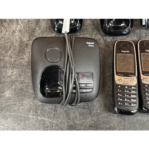 5085 - Three Gigaset C620 phone handsets with two charging docks and one Gigaset C620A answering machine