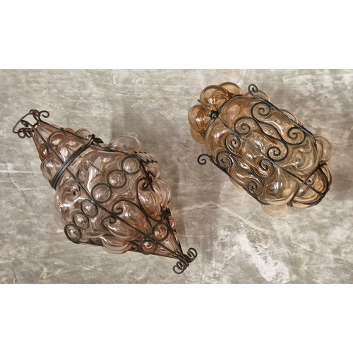 271A - Two Italian style black metal ans amethyst coloured glass lanterns