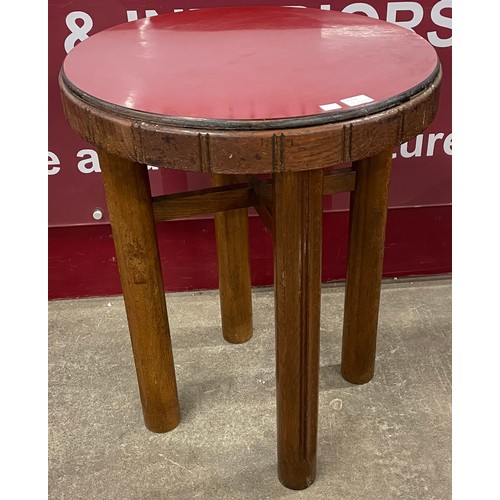 103A - An Art Deco oak and red Formica topped circular occasional table