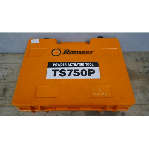 A cased Ramset TS750P powder actuated tool set with drive pins, wire ...