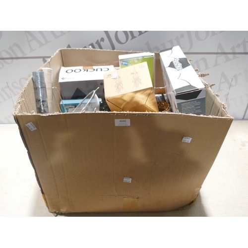 6040 - A box of miscellaneous items including blow up chair, cuckoo clock, trays, door wedge, glass jars, J... 
