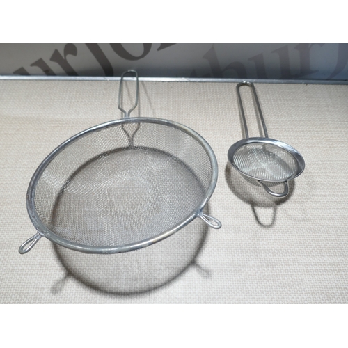 6040 - A box of miscellaneous items including blow up chair, cuckoo clock, trays, door wedge, glass jars, J... 