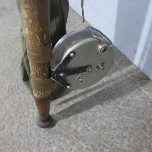 5256 - Two fishing rods (one 3 piece) and a reel