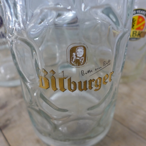 5171 - Eight large drinking glasses including Erdinger, Beneiktiner, Bitburger, etc.