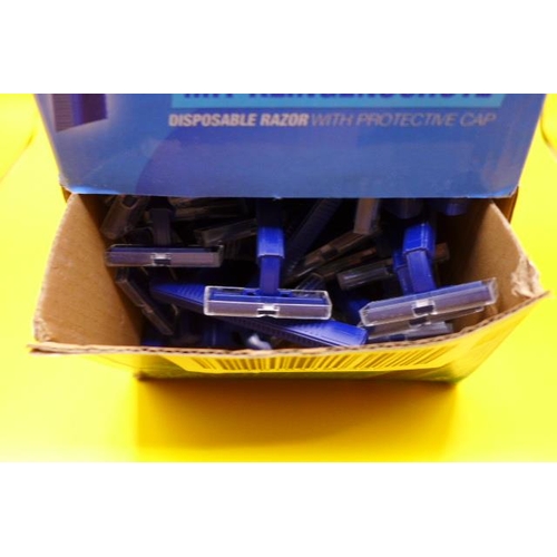 6264 - A box of disposable razors with protective caps  * This lot is subject to VAT