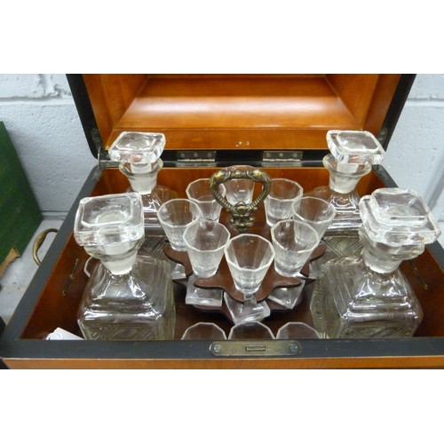 2369A - A Regency style inlaid burr walnut table-top drinks cabinet having an arrangement of decanters and l... 