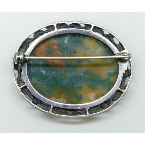 7047 - A Sydney & Co. Art Nouveau style silver brooch set with a moss agate panel, 4.2cm