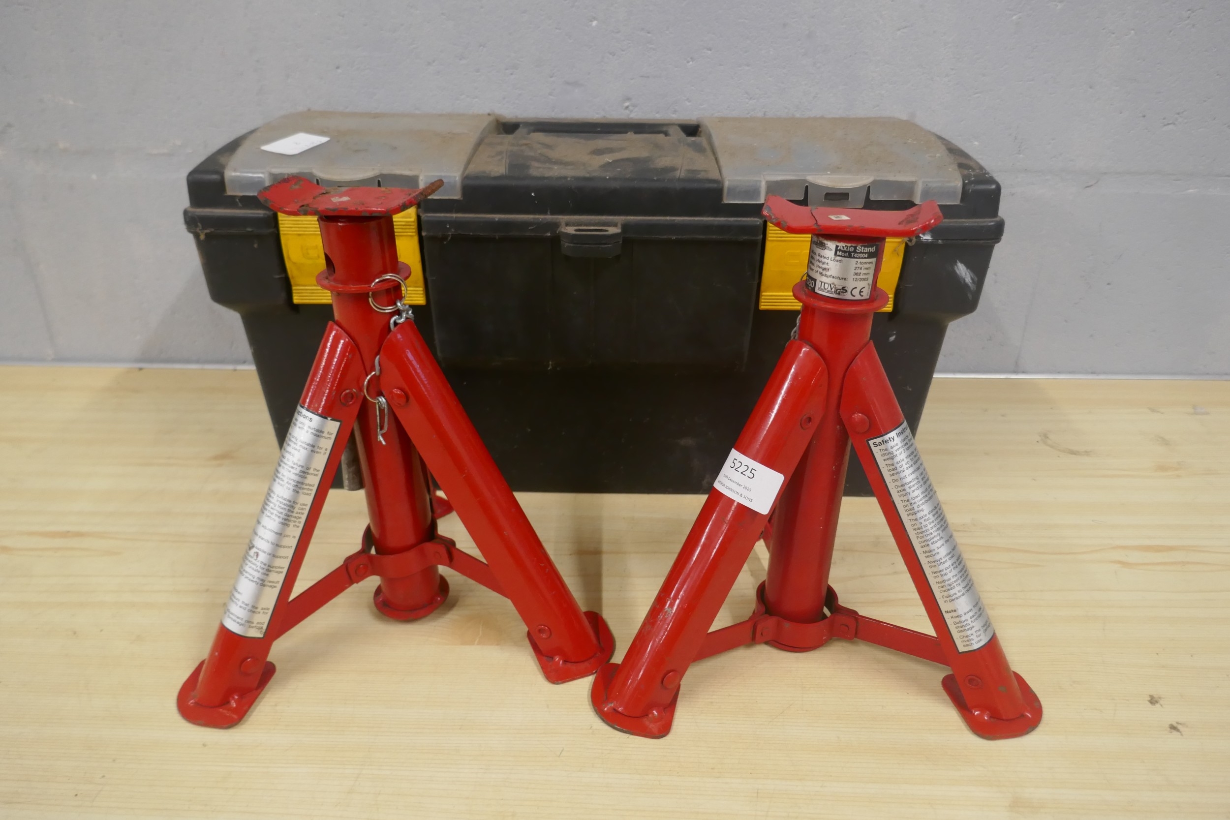 A pair of 2-tonne axel stands and a tool box with assorted hand tools ...
