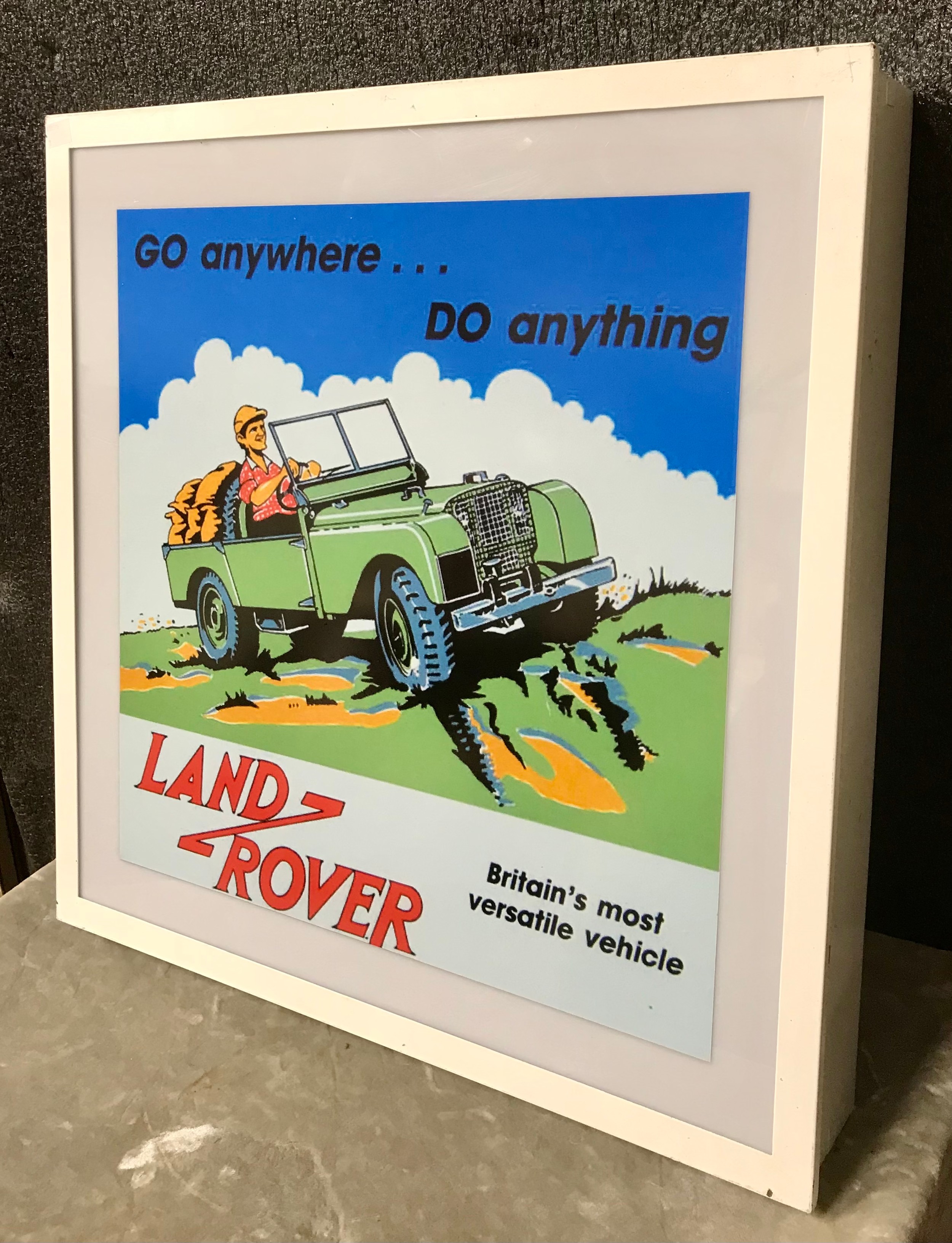 An illuminating Land Rover sign