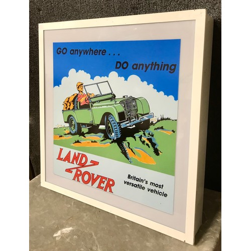 An illuminating Land Rover sign