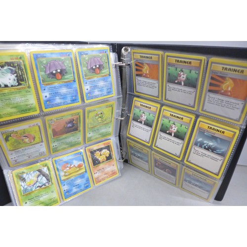 A vintage wizards of the coast Pokemon card binder, containing 300 cards  including 4th print, holofo