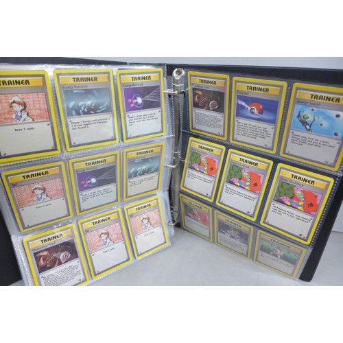 A vintage wizards of the coast Pokemon card binder, containing 300 cards  including 4th print, holofo