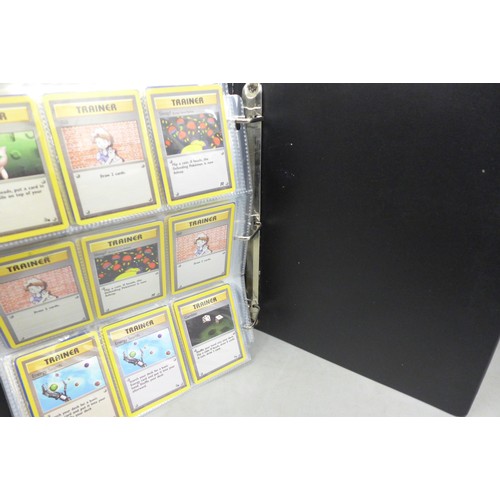 A vintage wizards of the coast Pokemon card binder, containing 300 cards  including 4th print, holofo