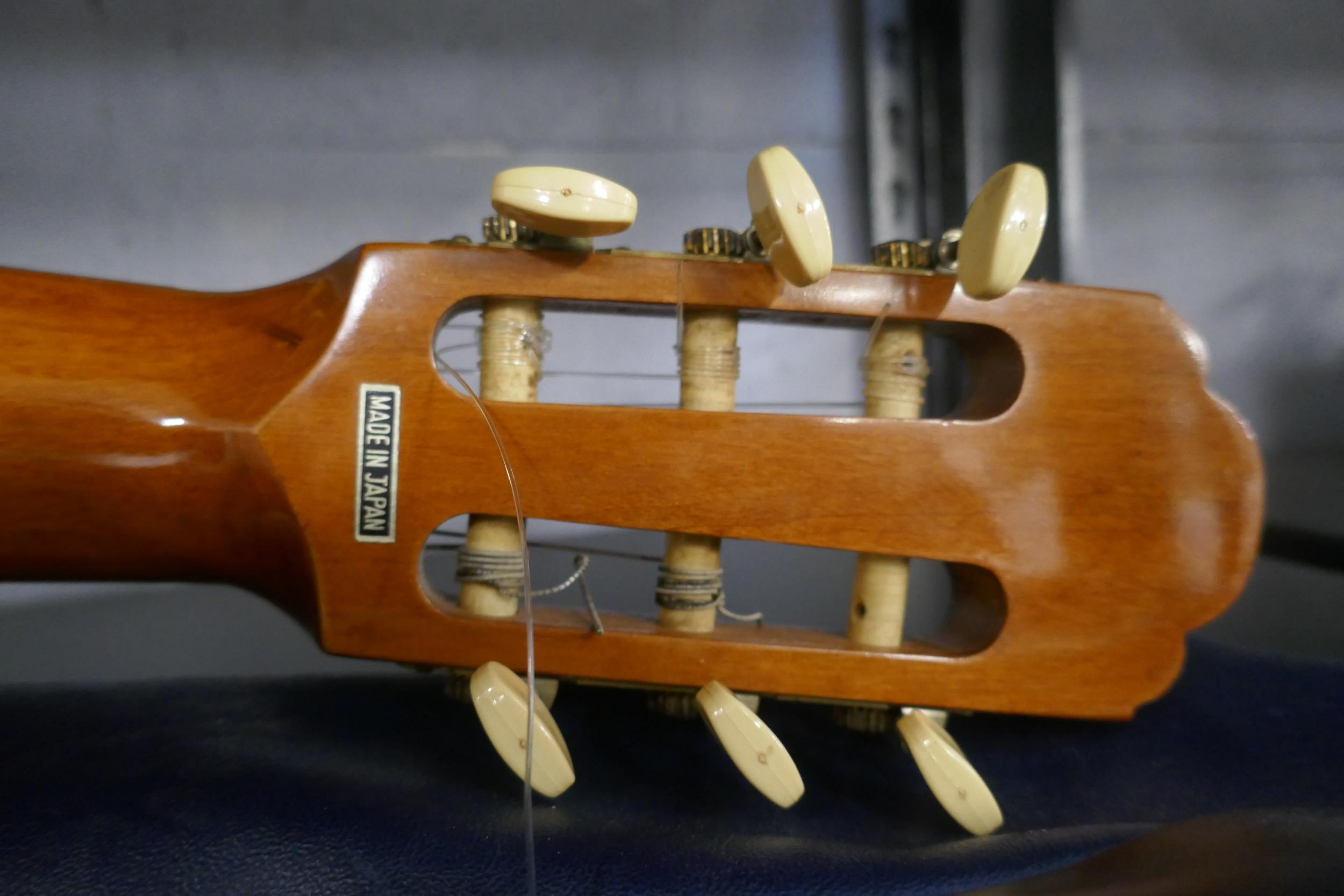 An Acks model No.70 Kiso Suzuki Violin Co. Ltd. acoustic guitar with case
