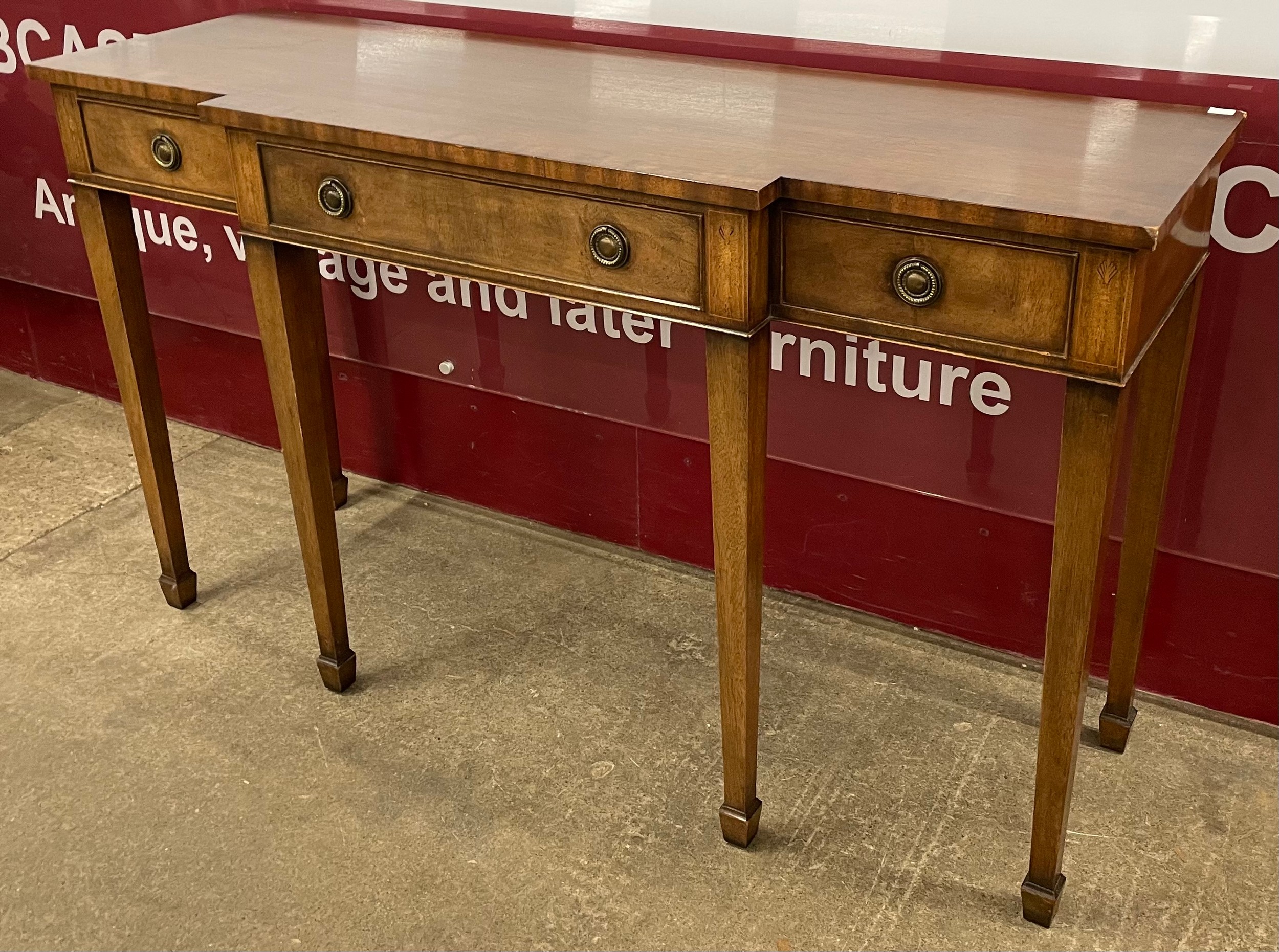 A Regency style mahogany breakfront console table