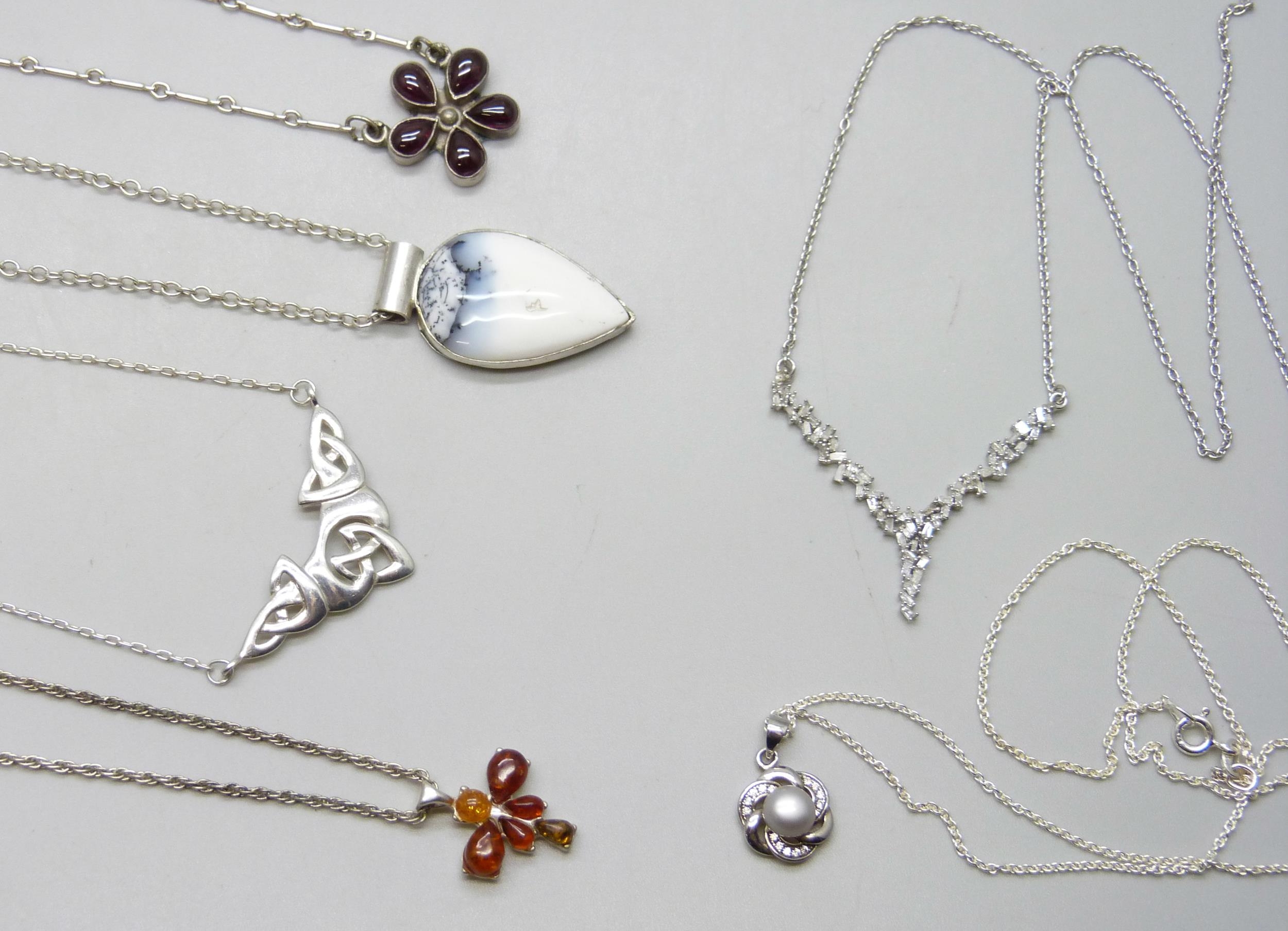 Ten silver pendants and chains including two Kit Heath pendants and a Y ...
