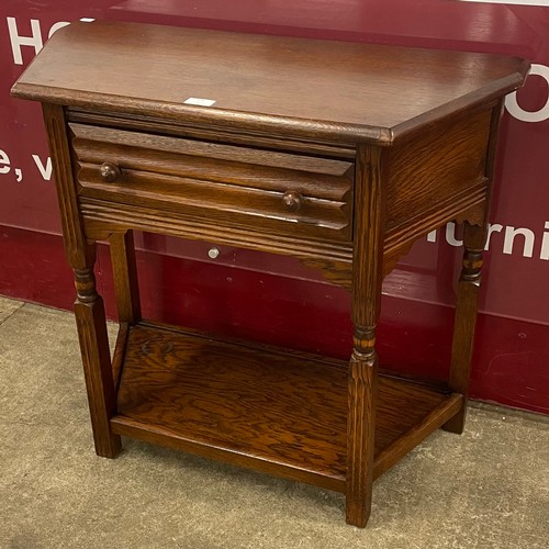130 - An 18th Century style oak single drawer side table