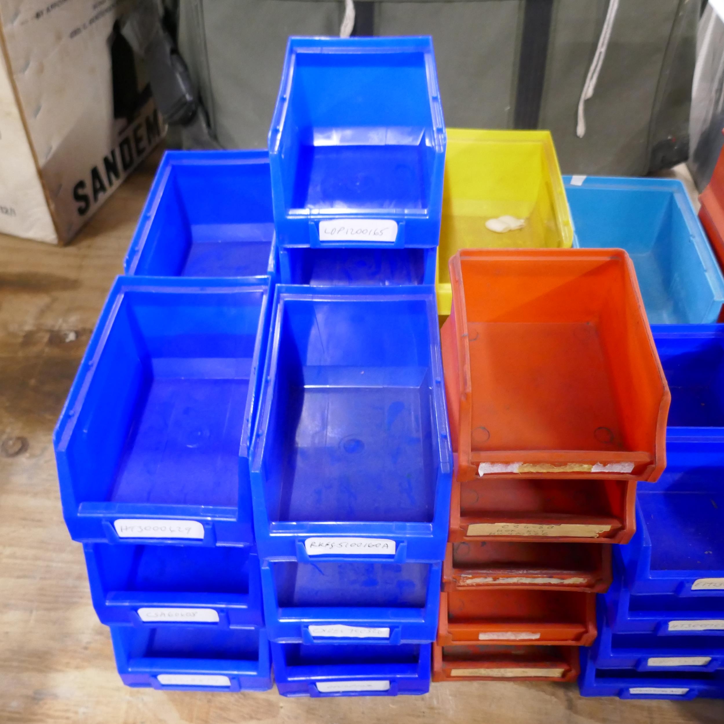 A large quantity of assorted plastic storage bins * This lot is sold as ...