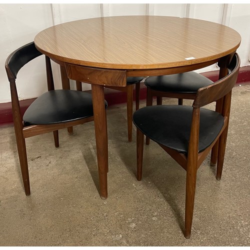 1 - A Danish Frem Rojle teak and simulated rosewood Roundette dining table and four chairs, designed by ...