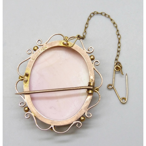 7008 - A 9ct gold framed Angel Skin cameo, clasp a/f, 13.3g, 3.9cm