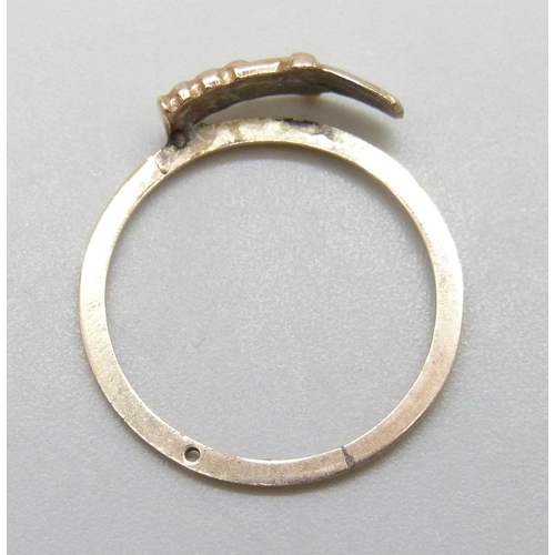 7013 - A ring with applied yellow metal plaque, a/f, 1.2g