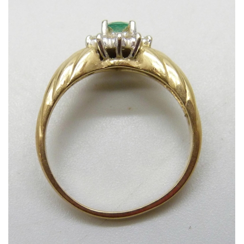7035 - A 14k gold, emerald and diamond cluster ring, 3.4g, M