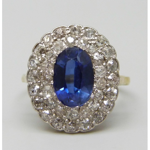 7037 - An 18ct gold, sapphire and old cut diamond cluster ring, sapphire 0.9cm, 4.3g, Q