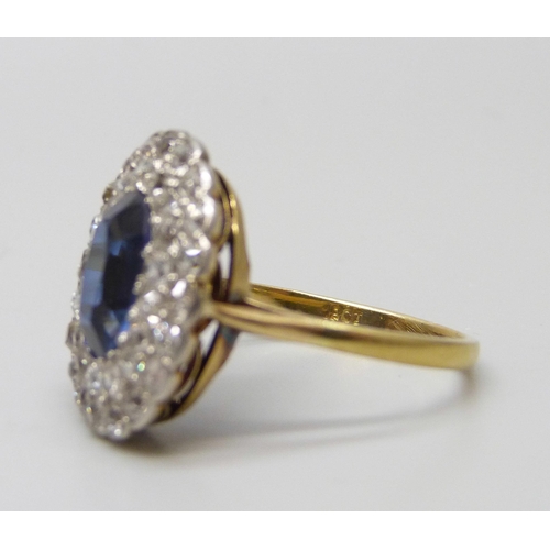 7037 - An 18ct gold, sapphire and old cut diamond cluster ring, sapphire 0.9cm, 4.3g, Q