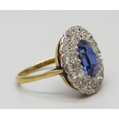 7037 - An 18ct gold, sapphire and old cut diamond cluster ring, sapphire 0.9cm, 4.3g, Q