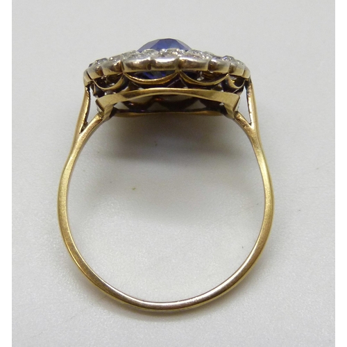 7037 - An 18ct gold, sapphire and old cut diamond cluster ring, sapphire 0.9cm, 4.3g, Q