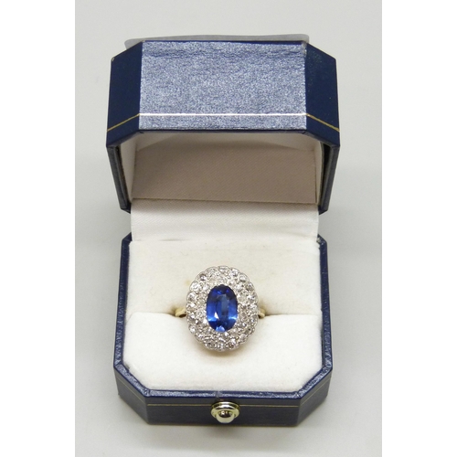 7037 - An 18ct gold, sapphire and old cut diamond cluster ring, sapphire 0.9cm, 4.3g, Q