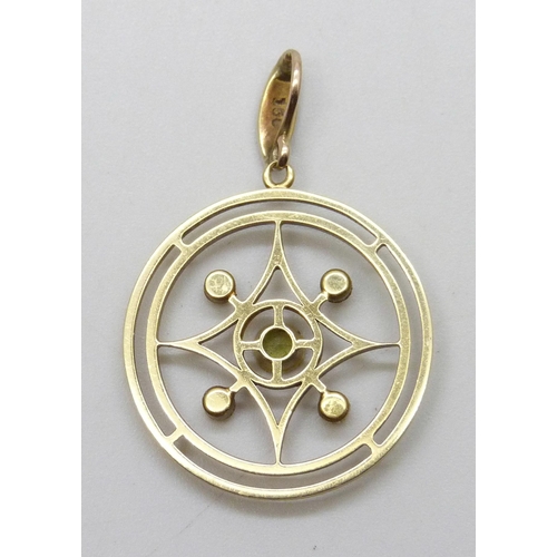 7050 - An Edwardian 15ct gold pendant set with peridot and seed pearls, one pearl missing, 3.4g, 3.5cm