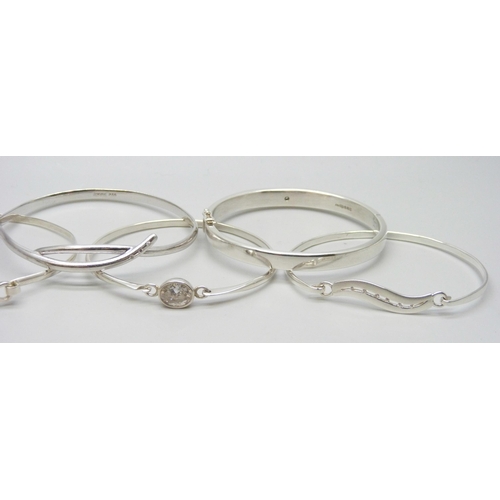 7053 - Six silver stone set bangles including two examples set with diamonds, 73g total